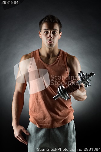 Image of young man with dumbbell