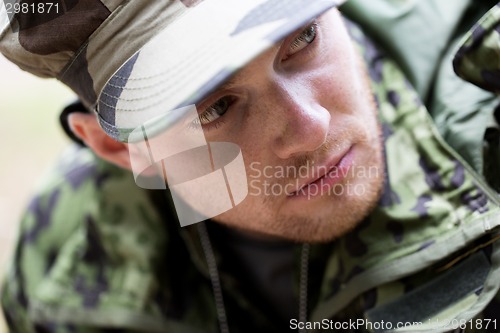 Image of close up of young soldier in military uniform