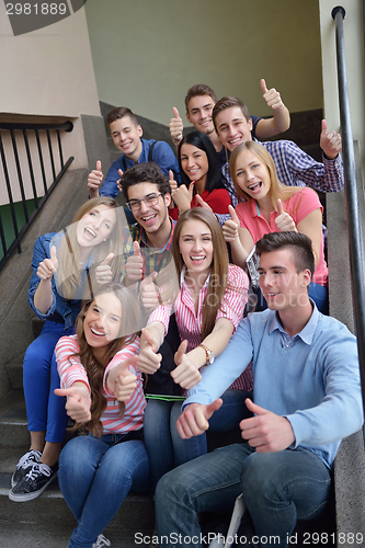 Image of happy teens group in school