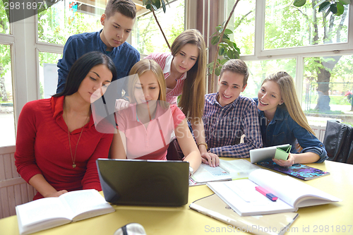 Image of happy teens group in school