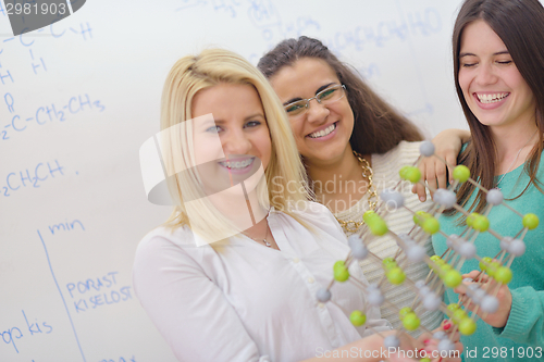 Image of happy teens group in school