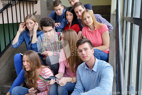 Image of happy teens group in school