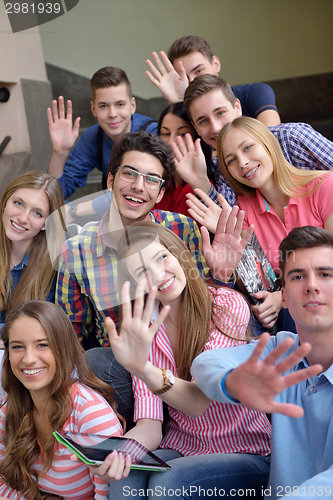 Image of happy teens group in school