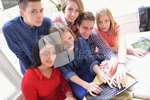 Image of happy teens group in school