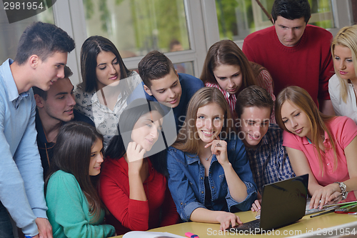 Image of happy teens group in school