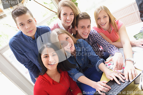 Image of happy teens group in school