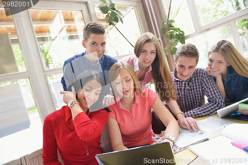 Image of happy teens group in school