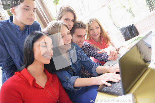 Image of happy teens group in school