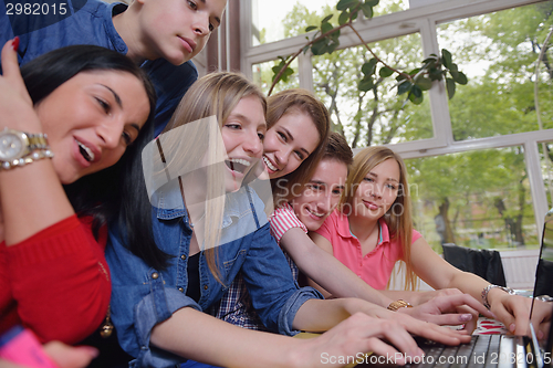 Image of happy teens group in school