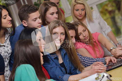 Image of happy teens group in school