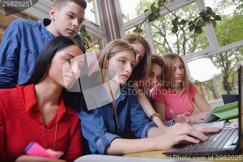 Image of happy teens group in school