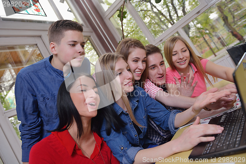 Image of happy teens group in school