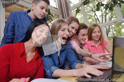 Image of happy teens group in school