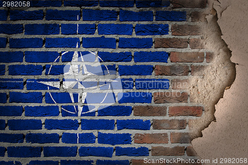 Image of Dark brick wall with plaster - NATO