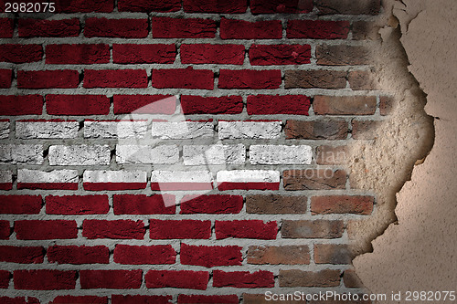 Image of Dark brick wall with plaster - Latvia