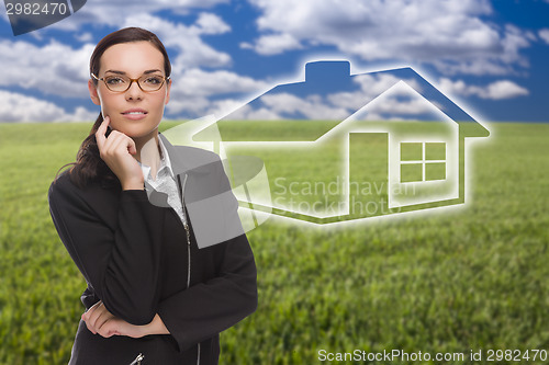 Image of Woman and Grass Field with Ghosted House Figure Behind