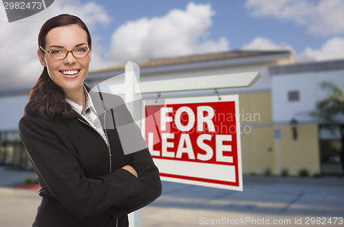 Image of Woman In Front of Commercial Building and For Lease Sign