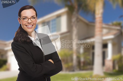 Image of Mixed Race Woman in Front of Residential House