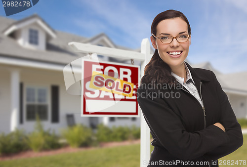Image of Mixed Race Woman in Front of House and Sold Sign
