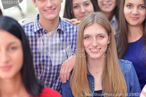 Image of happy teens group in school