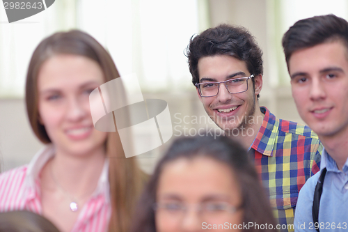 Image of happy teens group in school