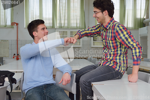 Image of happy teens group in school