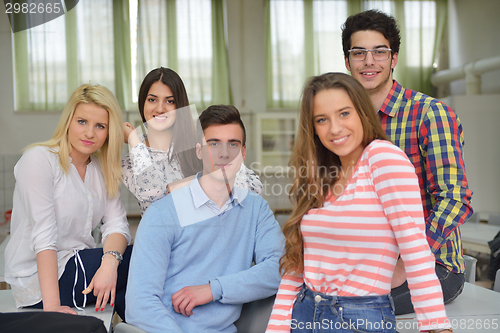 Image of happy teens group in school