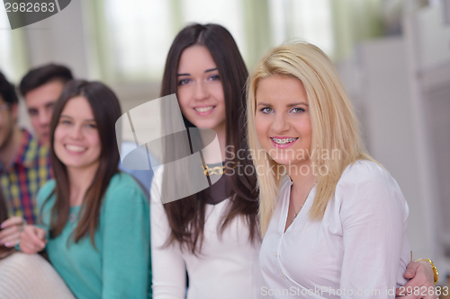 Image of happy teens group in school