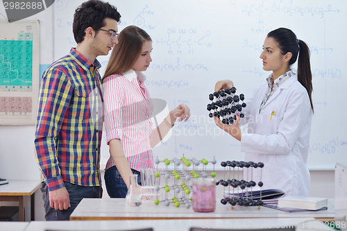 Image of happy teens group in school