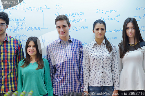 Image of happy teens group in school