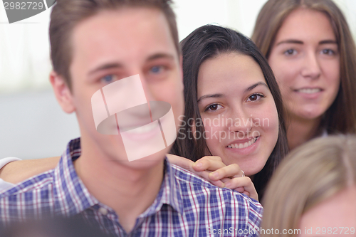 Image of happy teens group in school