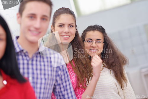 Image of happy teens group in school