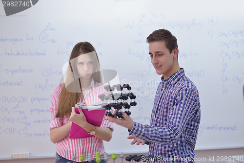 Image of happy teens group in school