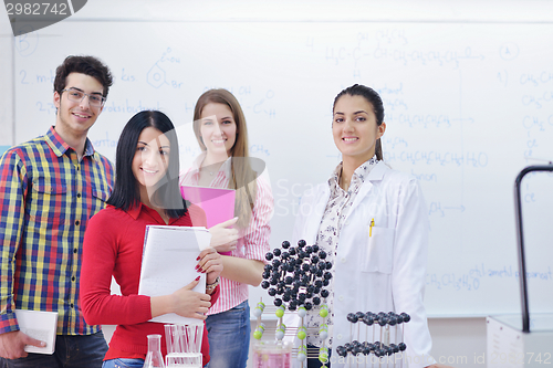 Image of happy teens group in school