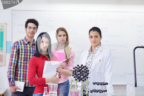 Image of happy teens group in school