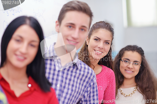 Image of happy teens group in school