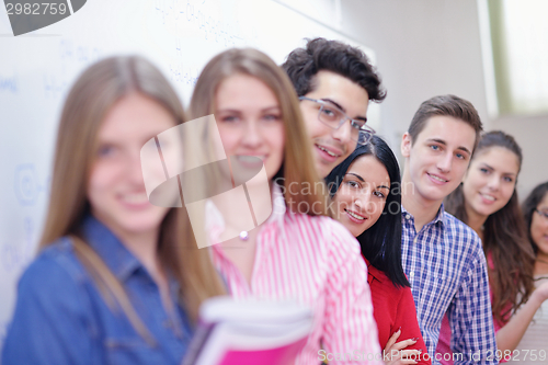 Image of happy teens group in school