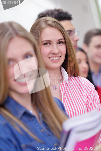 Image of happy teens group in school