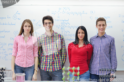 Image of happy teens group in school