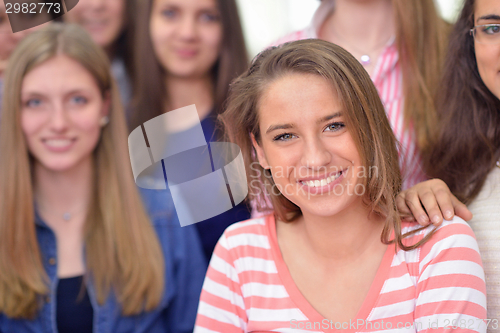 Image of happy teens group in school