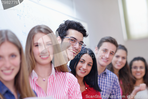 Image of happy teens group in school