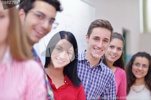 Image of happy teens group in school