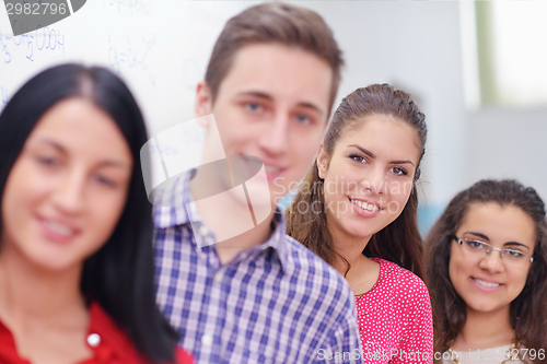 Image of happy teens group in school