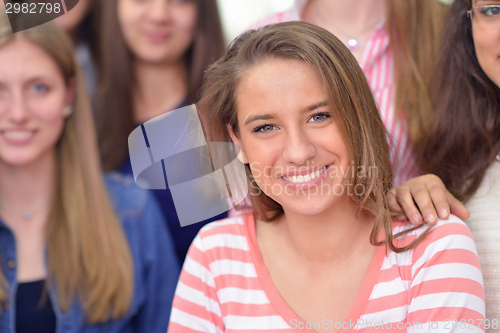 Image of happy teens group in school