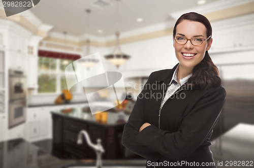 Image of Mixed Race Young Woman Standing in Beautiful Custom Kitchen