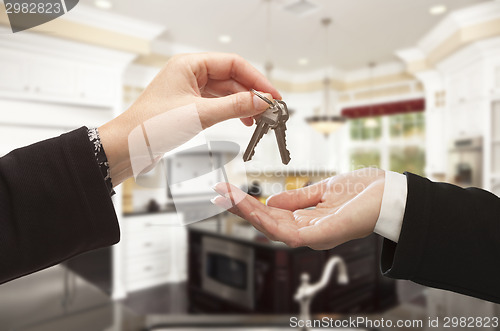 Image of Handing Over New House Keys Inside Beautiful Home