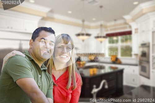 Image of Mixed Race Couple Inside Beautiful Custom Kitchen