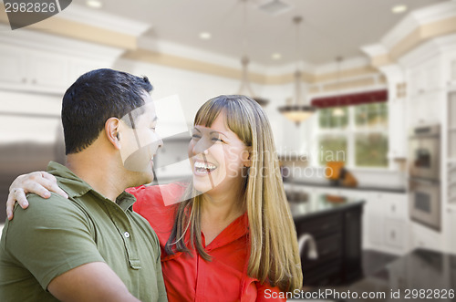 Image of Mixed Race Couple Inside Beautiful Custom Kitchen