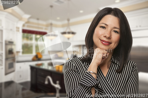 Image of Hispanic Woman Standing in Beautiful Custom Kitchen