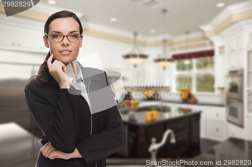 Image of Mixed Race Young Woman Standing in Beautiful Custom Kitchen